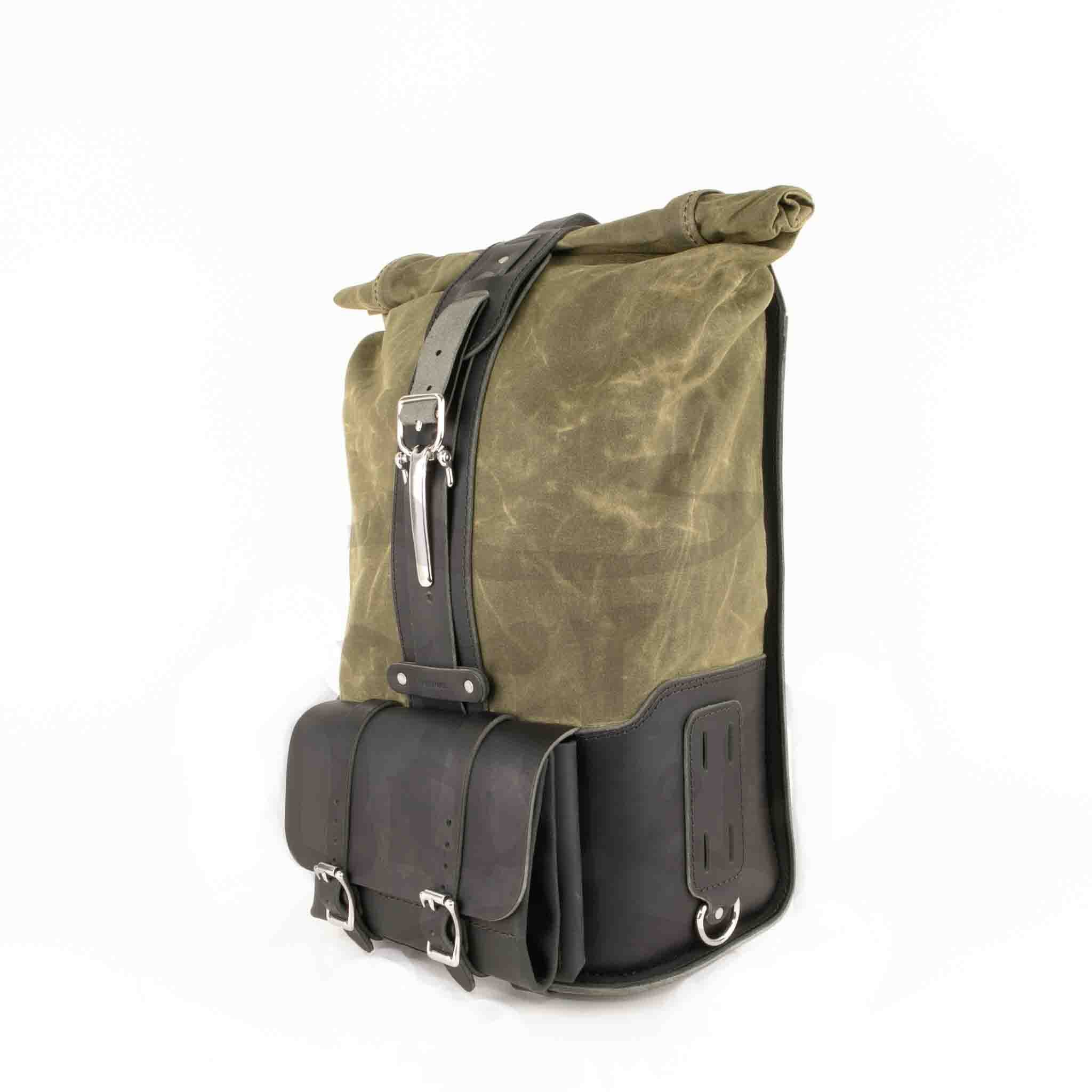Upgrade your ride with the URB02 Rolltop Backpack Saddlebag. Unique design enables quick conversion from saddlebag to backpack. Hand crafted in USA with premium veg tan water buffalo leather, waxed canvas and stainless steel hardware. Durable and stylish, it's the perfect fit for your motorcycle.