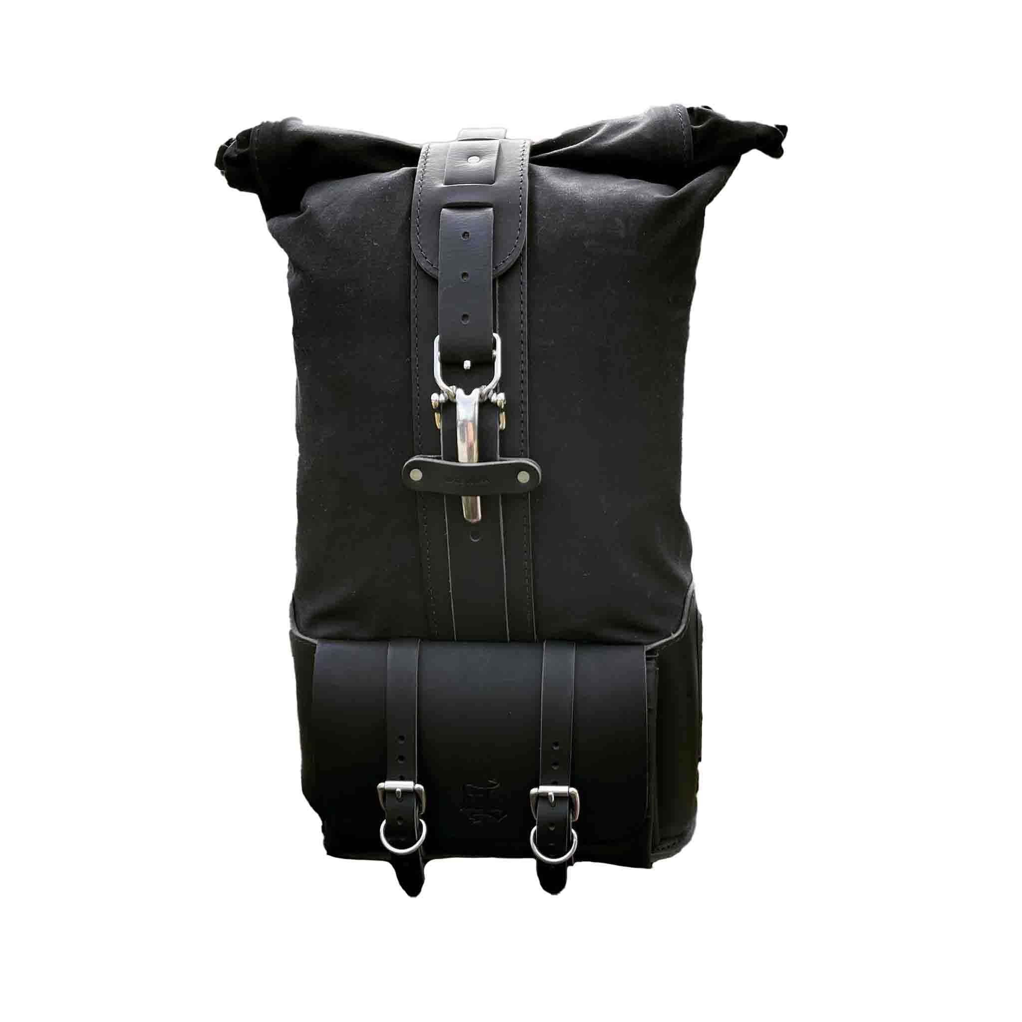 Upgrade your ride with the URB03 Rolltop Backpack Saddlebag. Unique design enables quick conversion from saddlebag to backpack. Hand crafted in USA with premium veg tan water buffalo leather, waxed canvas and stainless steel hardware. Durable and stylish, it's the perfect fit for your motorcycle.