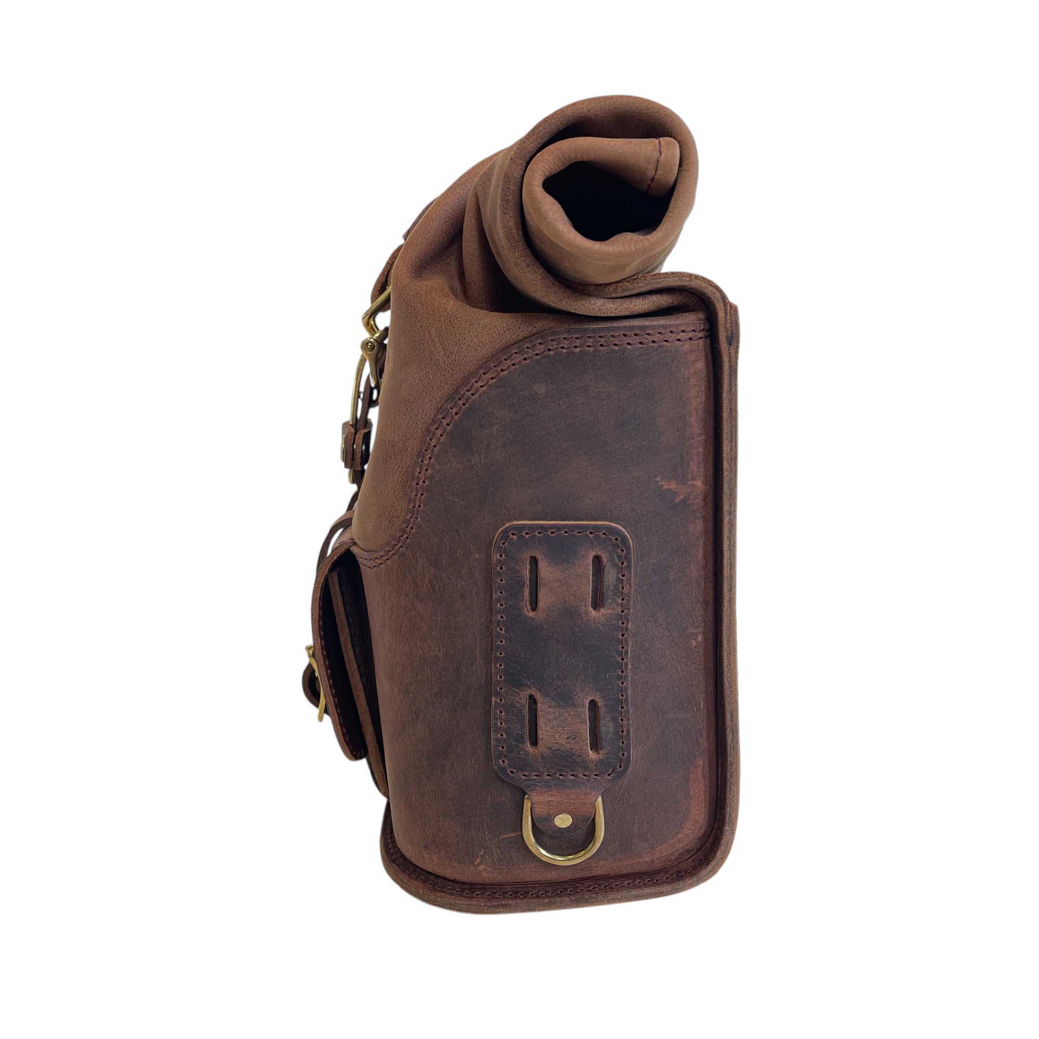 Triumph Bonneville Bobber Panniers Rolltop Swingarm Saddlebags. Hand crafted in USA with premium veg tan water buffalo leather, waterproof liners and solid brass hardware. BAD&G Customs TBP01